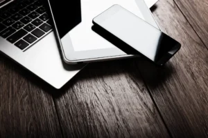 Laptop, tablet, and smartphone, representing comprehensive managed IT services.