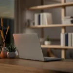 Laptop on a desk at twilight, representing 24/7 managed IT services.