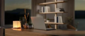 Laptop on a desk at twilight, representing 24/7 managed IT services.